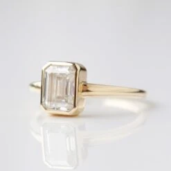 Moissanite Octagon Emerald Cut Bezel Set Ring 13 Moissanite Octagon Emerald Cut Bezel Set Ring -Carrie Elizabeth 2603DBAC A3CC 42B0 B54A 5A85CACE2045